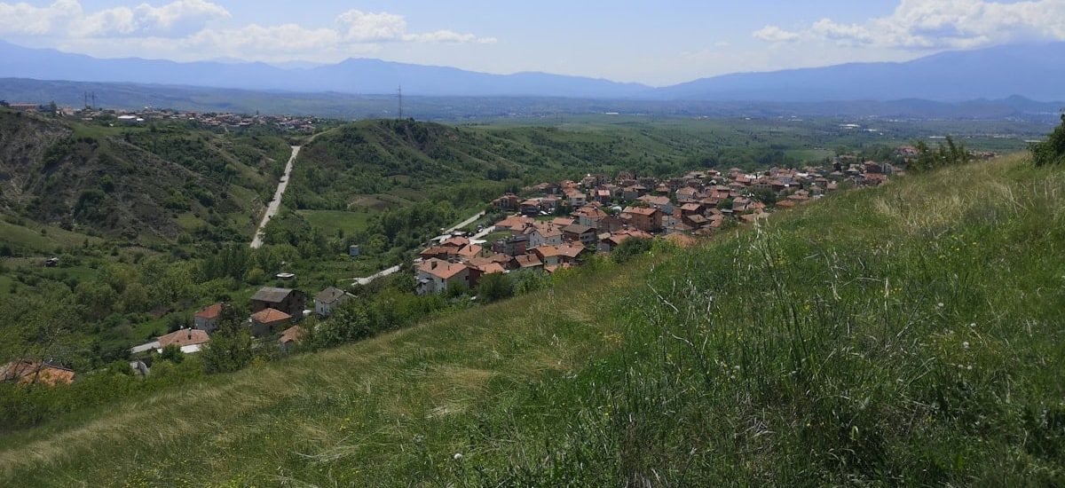 a view of a small village on a hill