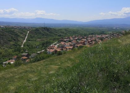 a view of a small village on a hill